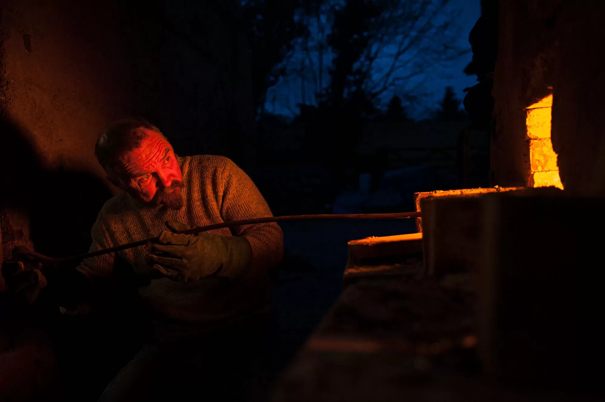 Potter Nic Collins firing his wood kiln